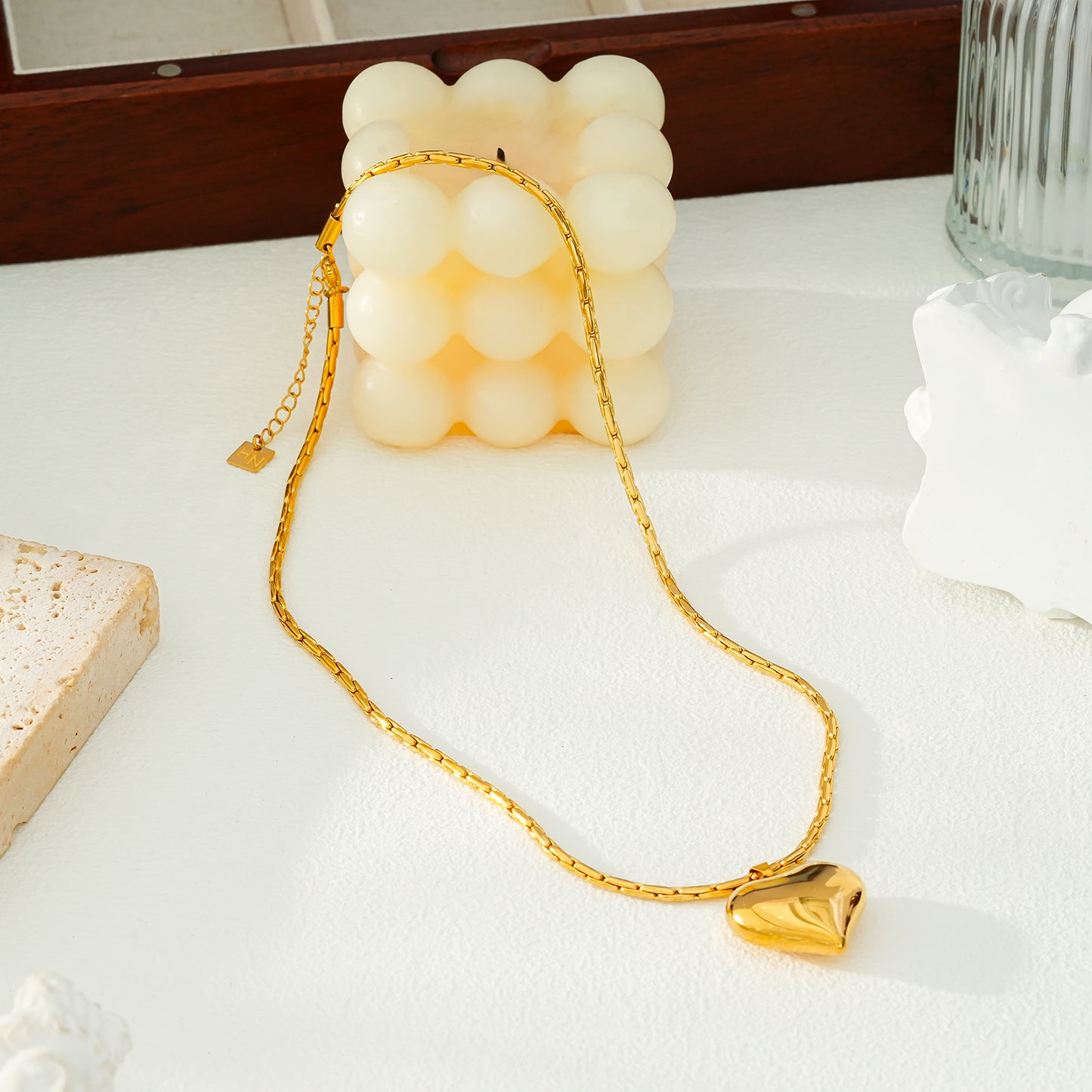 ABEL: Engineered Cable Chain with Puffy Heart Pendant in Gold.