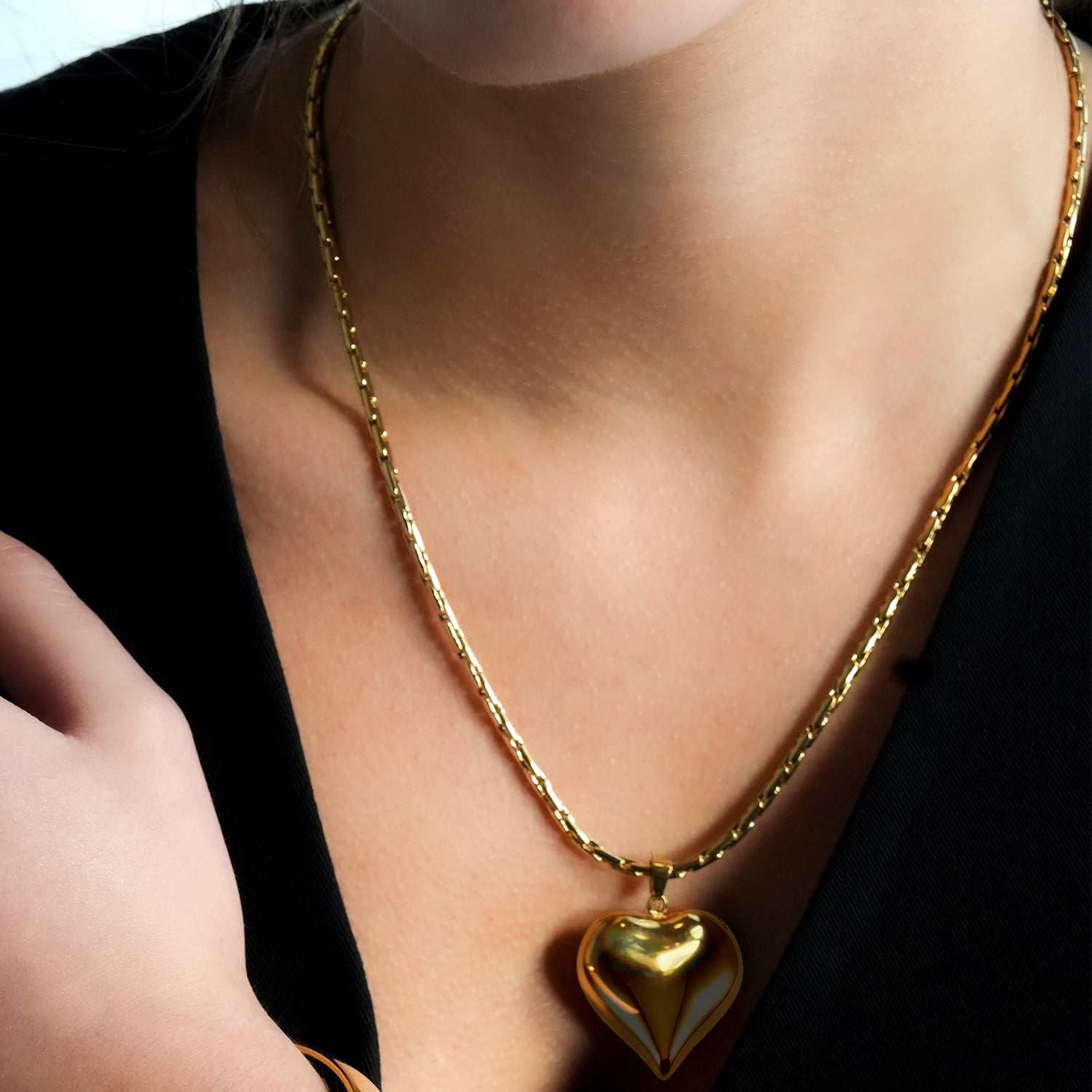 ABEL: Engineered Cable Chain with Puffy Heart Pendant in Gold.