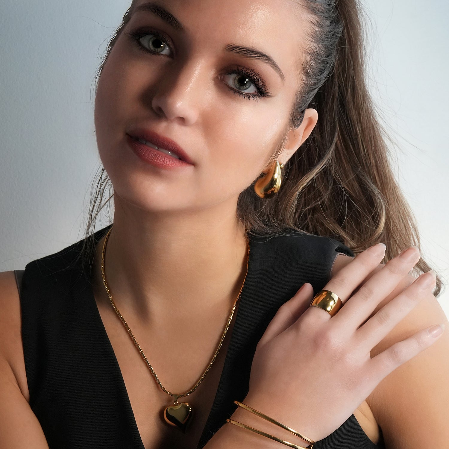 ABEL: Engineered Cable Chain with Puffy Heart Pendant in Gold.