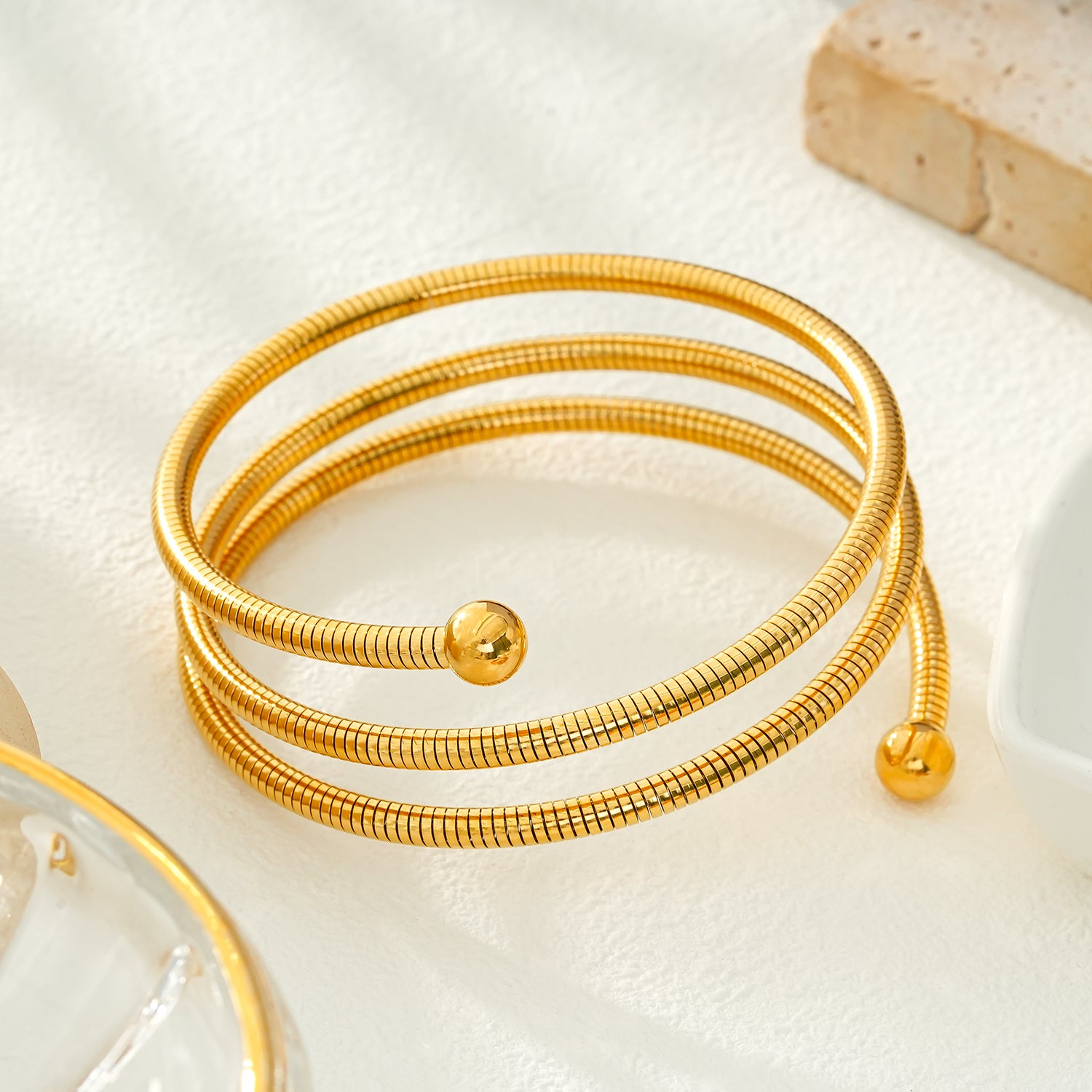 BASHEE: Triple Stacked Gold Bracelet with Surface Lines & Ball Bead Accents.