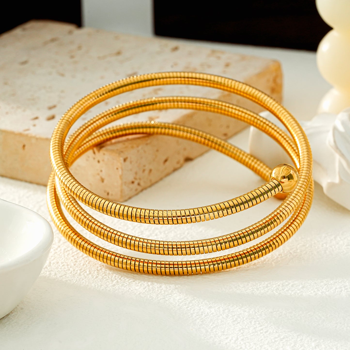 BASHEE: Triple Stacked Gold Bracelet with Surface Lines & Ball Bead Accents.