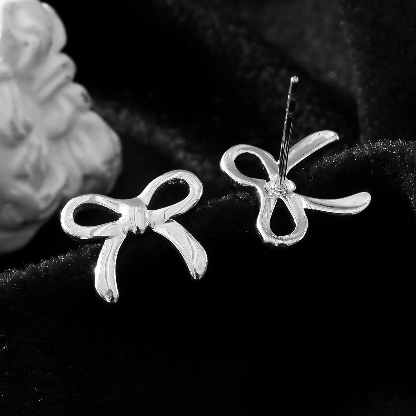 BOW: Silver Toned White Gold Bow Shaped Stud Earrings