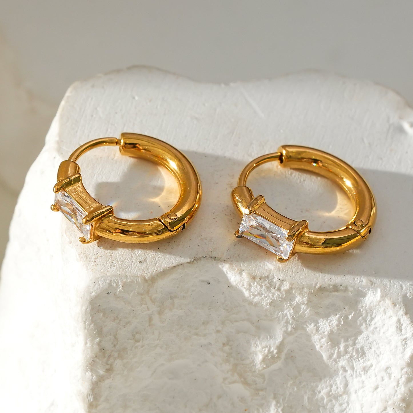 Style CONWYN: Retro Style Hoops with an Encased Clear Zirconia Charm.