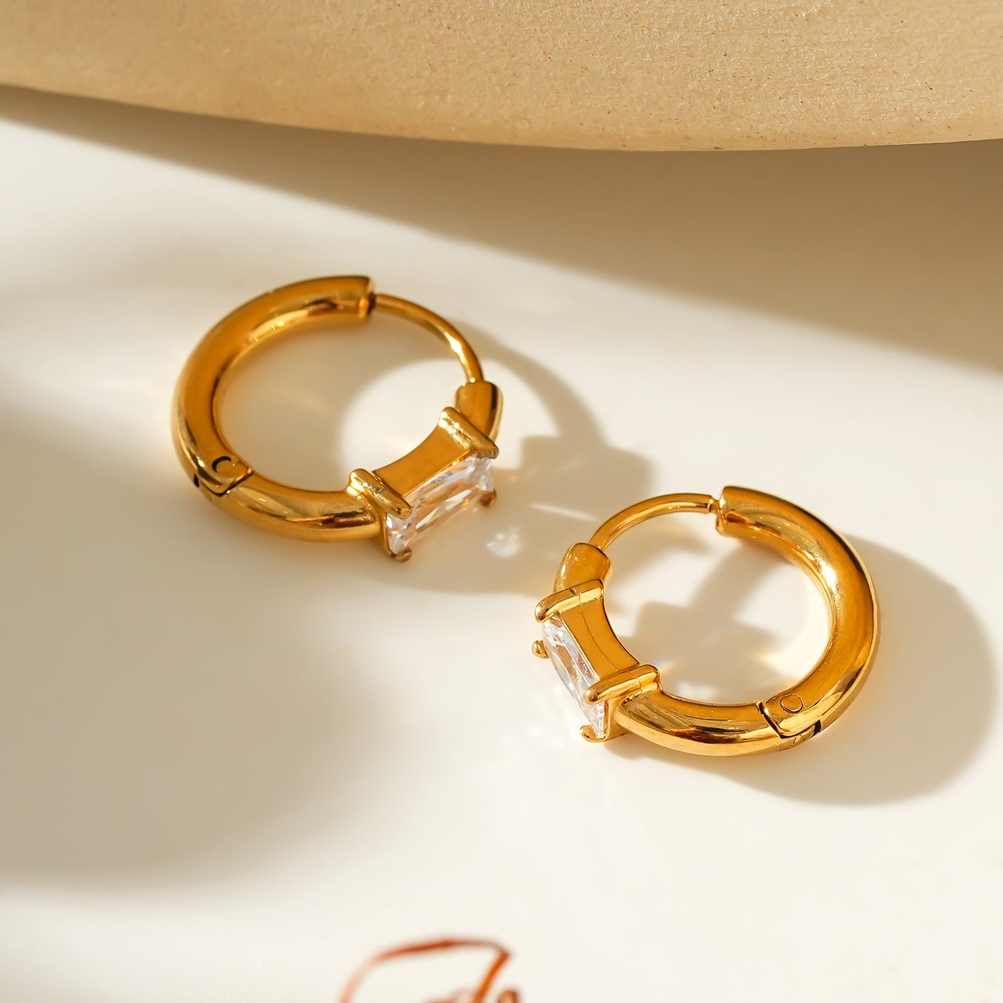 Style CONWYN: Retro Style Hoops with an Encased Clear Zirconia Charm.