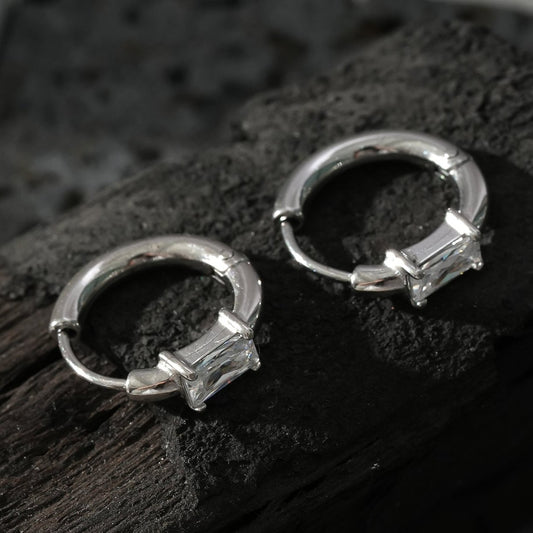 Style CONWYN: Retro Style Hoops with an Encased Clear Zirconia Charm in Silver.