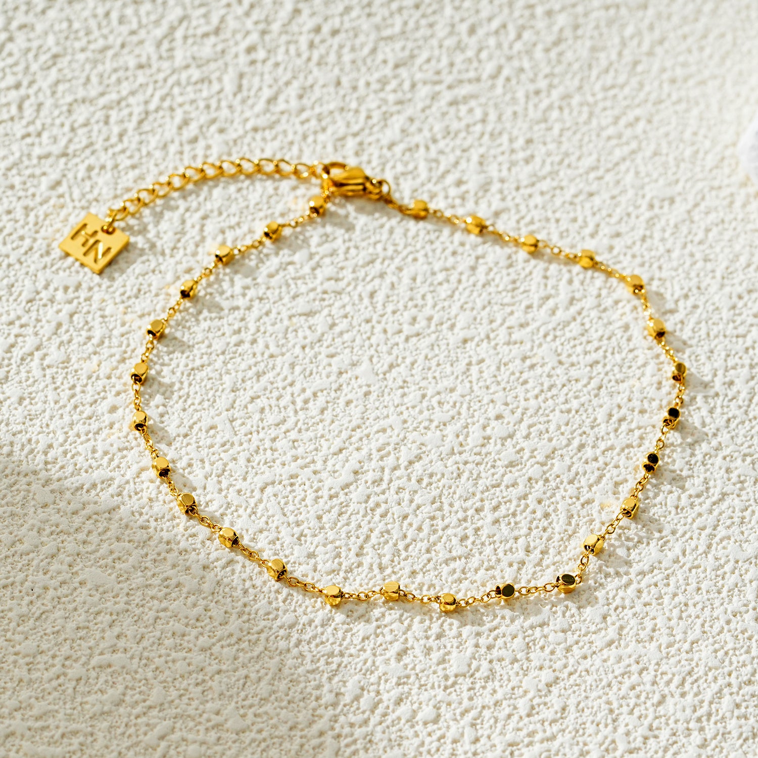 Style DEMELZA 8191G: Contemporary Gold Anklet with Delicate Square Beads.&nbsp;