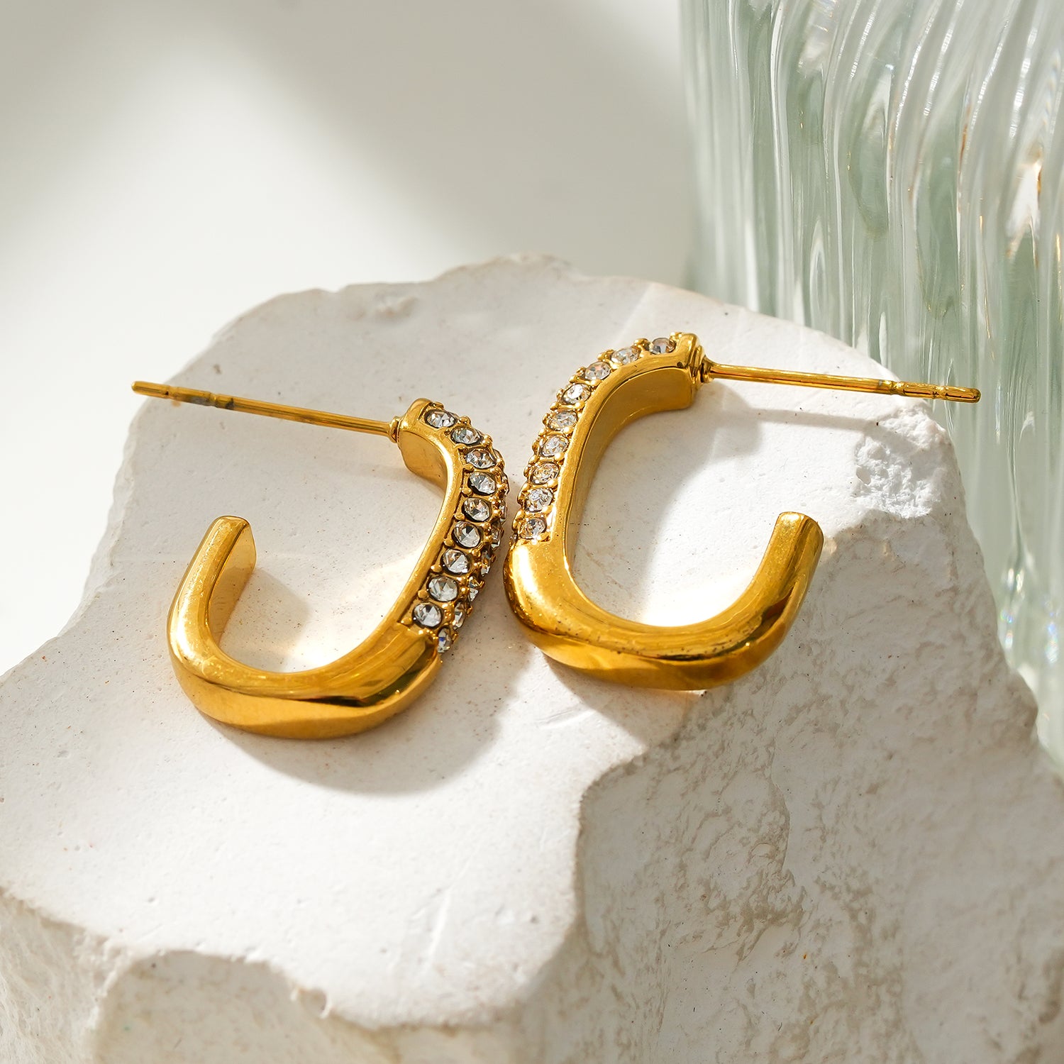 Style FIRLE: Partial Pavé Zirconia Oval Hoop Earrings