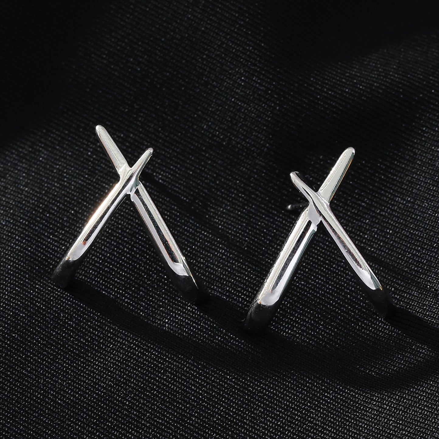 LINDSBORG: Criss-Cross Geometric Stud Earrings in White Gold (Silver Toned)