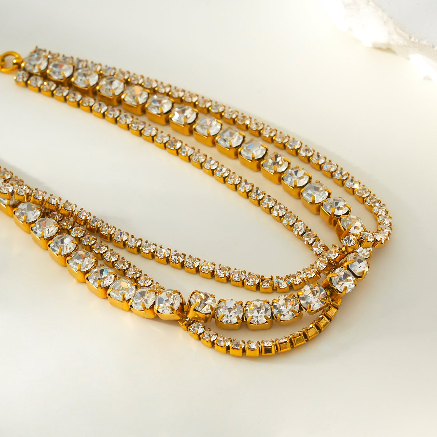 NANDAMA Gold: Pre-Layered & Stacked for Glamour - Three-Row Zirconia (CZ) Tennis Bracelet with Bold Centerpiece