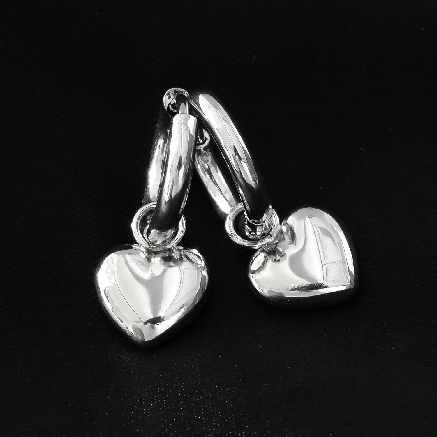 Mini Hoop Earrings Anchoring a Heart Shaped Charm - Style STOWE in Silver Toned White Gold