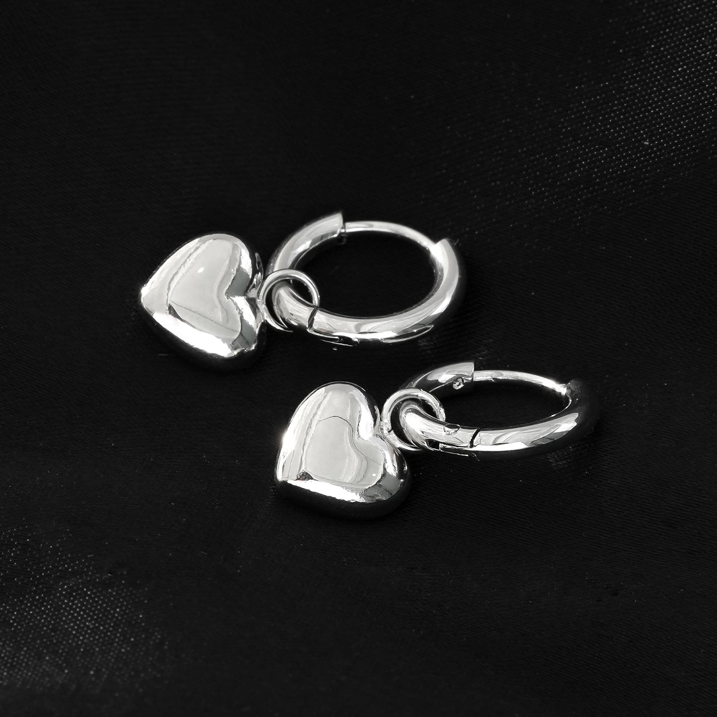 Mini Hoop Earrings Anchoring a Heart Shaped Charm - Style STOWE in Silver Toned White Gold