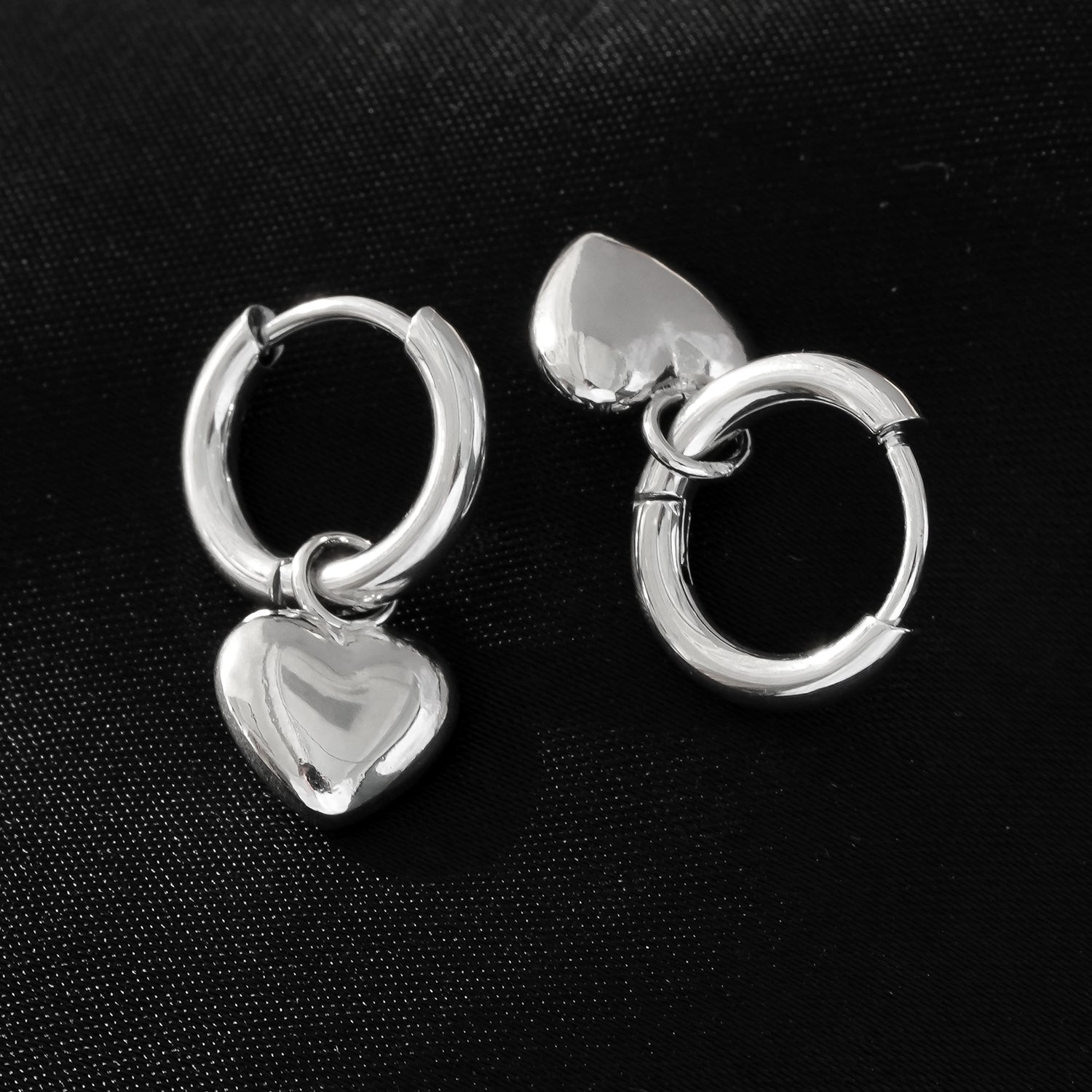 Mini Hoop Earrings Anchoring a Heart Shaped Charm - Style STOWE in Silver Toned White Gold