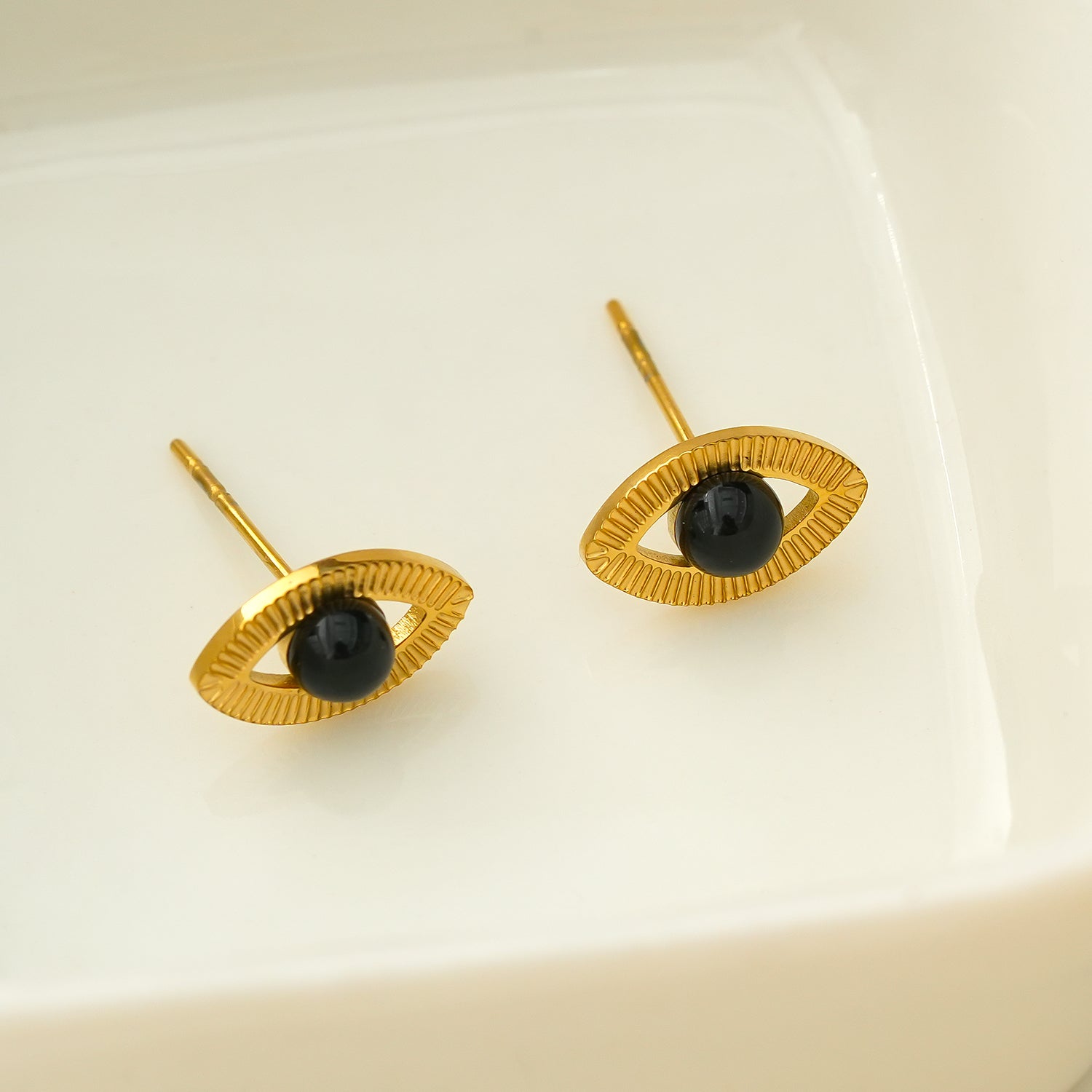 TAVIRA: Gold Evil Eye Studs with Black Onyx Embellishment