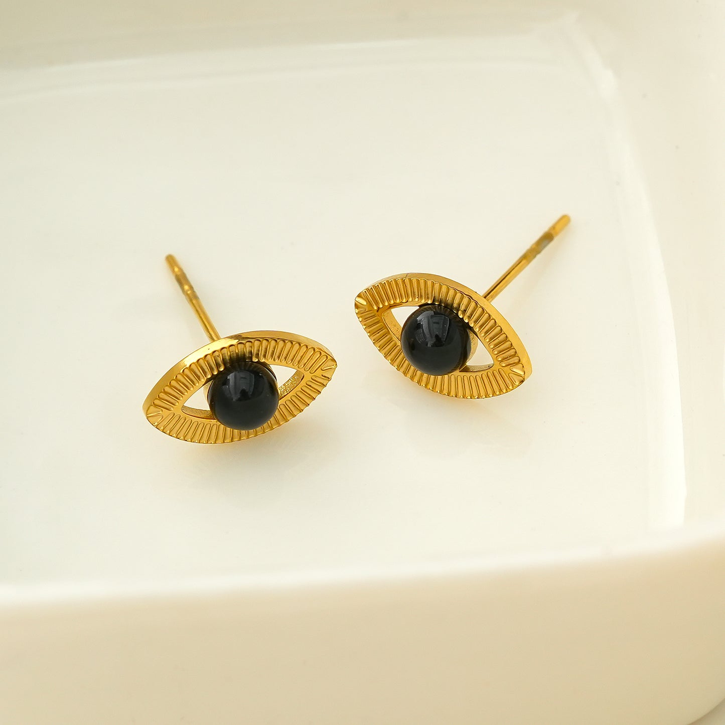 TAVIRA: Gold Evil Eye Studs with Black Onyx Embellishment