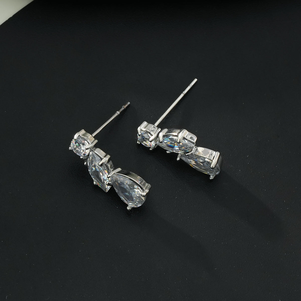 THEOLA: Radiance Triple Moissanite Stack Stud Earrings in Silver Toned White Gold