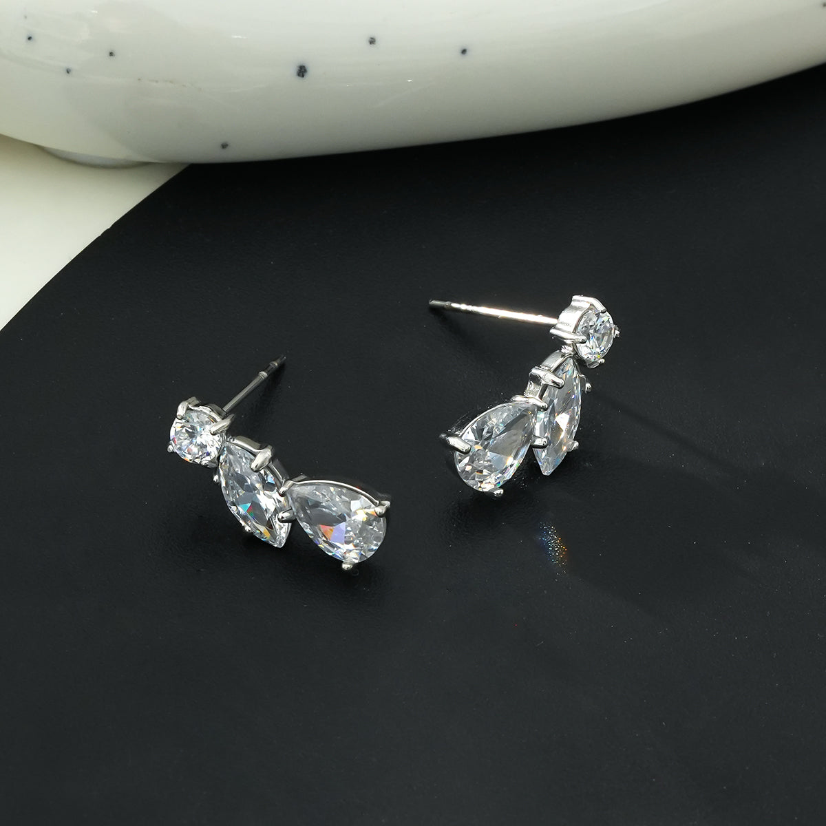 THEOLA: Radiance Triple Moissanite Stack Stud Earrings in Silver Toned White Gold