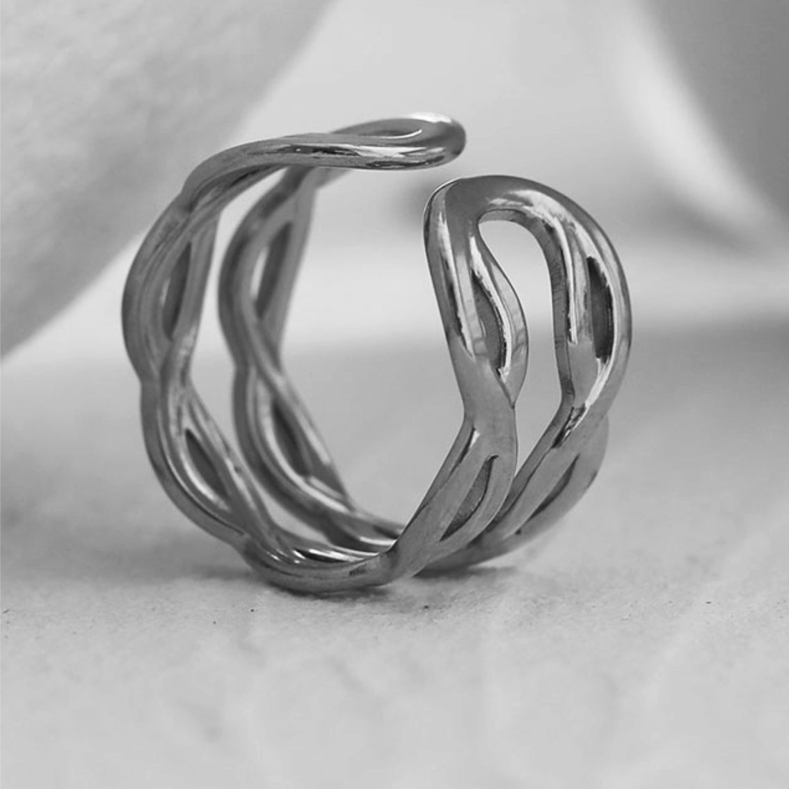 VENESSA Silver Toned White Gold:  Intertwined Repeated Pattern Adjustable Ring